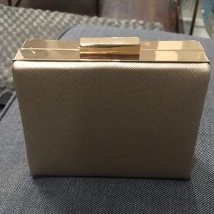 Gold evening clutch with chain.